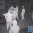 The group were caught on CCTV celebrating in an alley