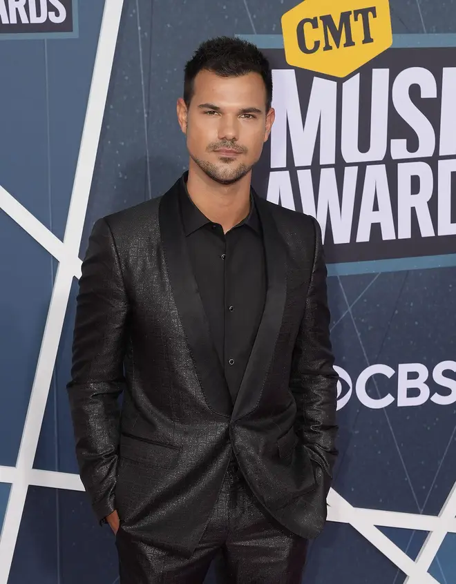 Taylor Lautner joked he 'feels safe' ahead of the re-release of 'Speak Now'