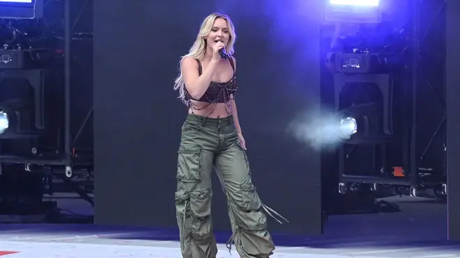 Zara wore a crop top and cargo pants on stage