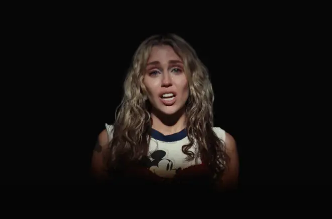 Miley Cyrus wears a Mickey Mouse top in her 'Used To Be Young' video