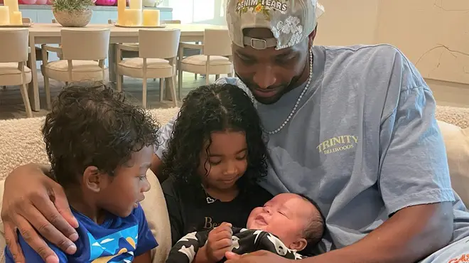 Tristan Thompson cuddling his children