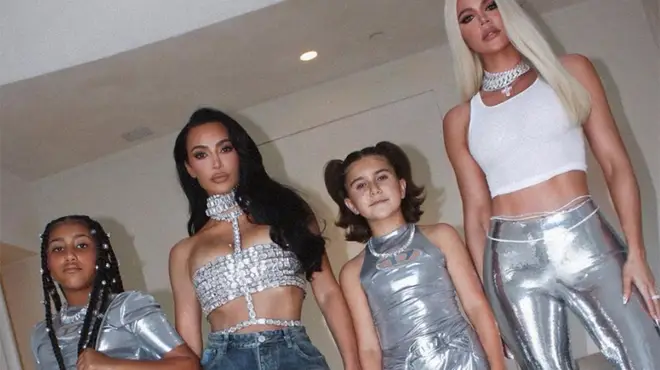 North West, Kim Kardashian, Penelope Disick and Khloe Kardashian all dressed in silver