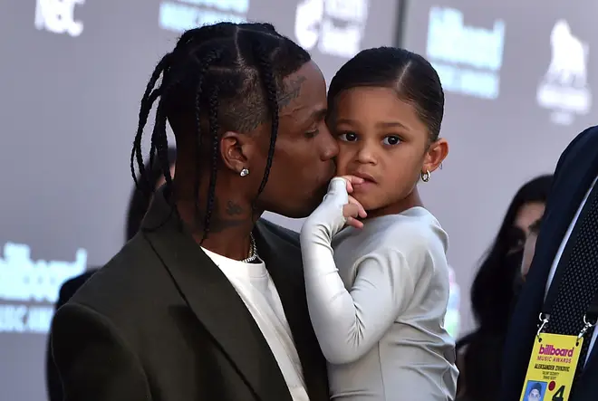 Travis Scott and his daughter Stormi Webster arrive at the Billboard Music Awards in 2022