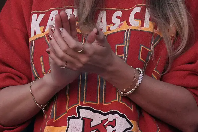Taylor Swift wears a friendship bracelet with Travis Kelce's number 87