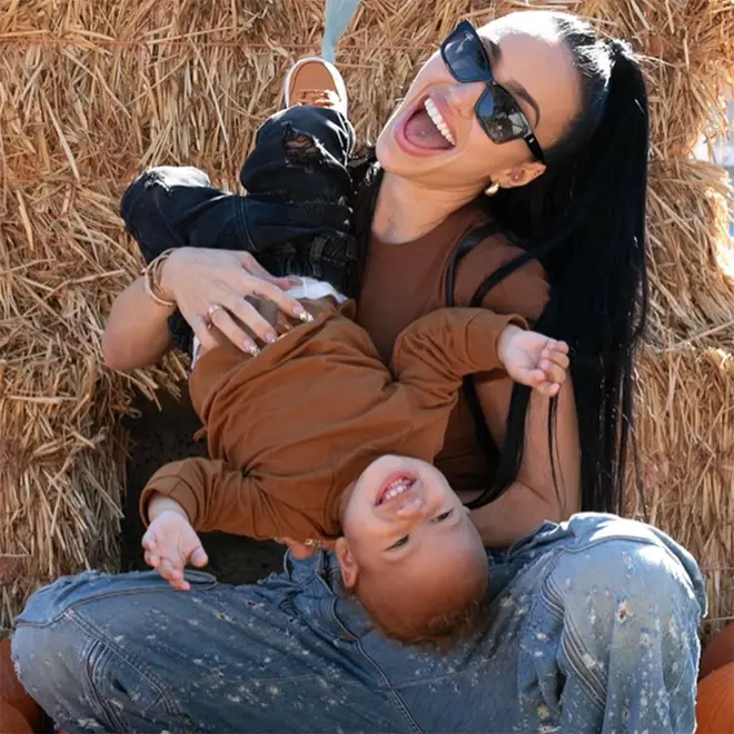 Bre Tiesi playing with her son Legendary at a pumpkin patch
