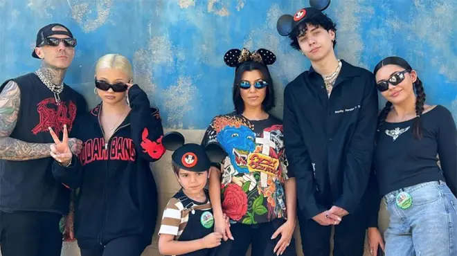 Kourtney Kardashian and Travis Barker in Disney with their children