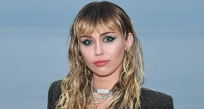 Miley Cyrus attends the Saint Laurent Mens Spring Summer 20 Show.