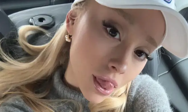 Ariana selfie in the back of the car sticking her tongue out