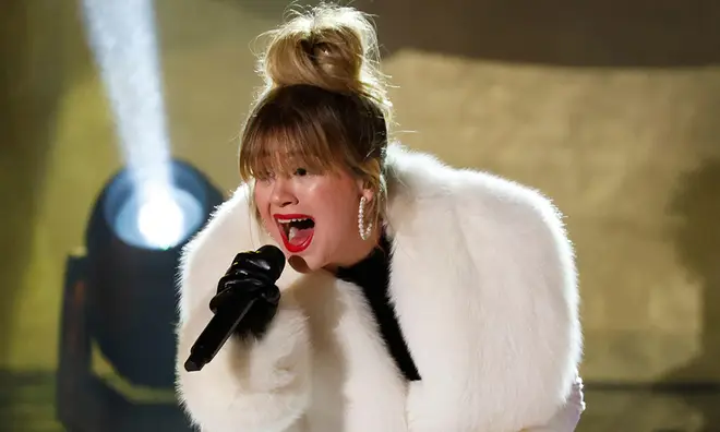 Kelly Clarkson singing at the Rockerfella Center in New York