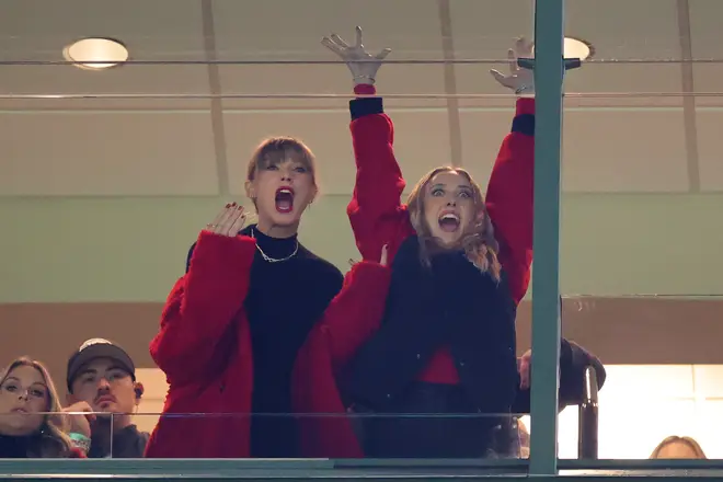 Taylor Swift and Brittany Mahomes reacting in a suite during the game between the Kansas City Chiefs and the Green Bay Packers