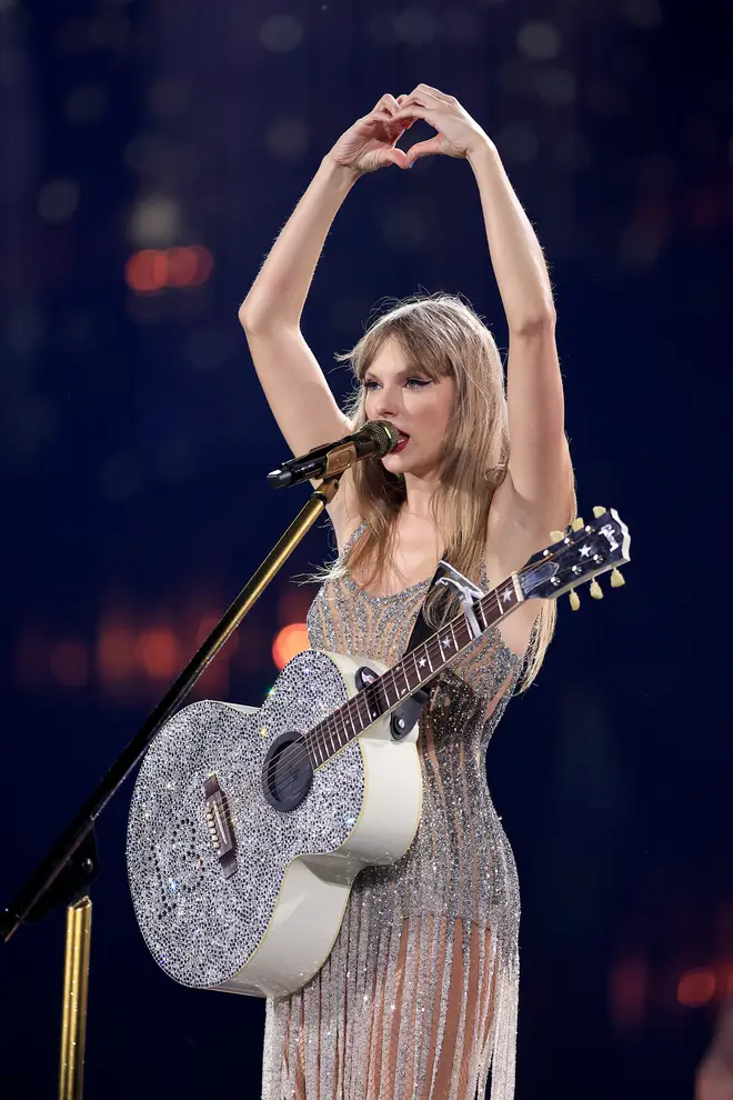 Taylor Swift's signature heart hands pose for Fearless