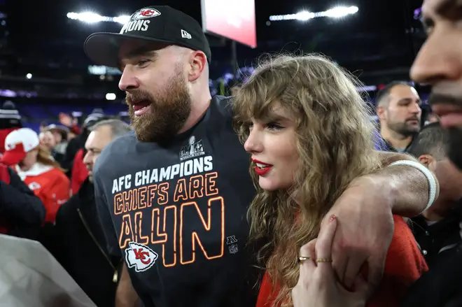 Travis Kelce of the Kansas City Chiefs celebrates with Taylor Swift after winning against Baltimore Ravens