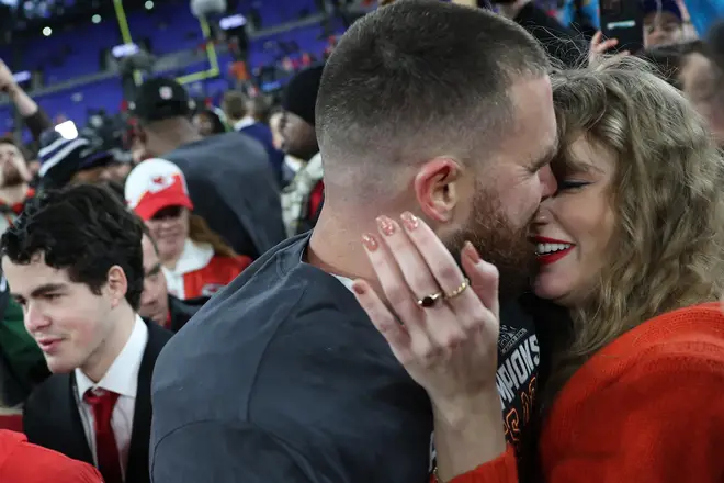 Taylor and Travis celebrate Chiefs win with a kiss