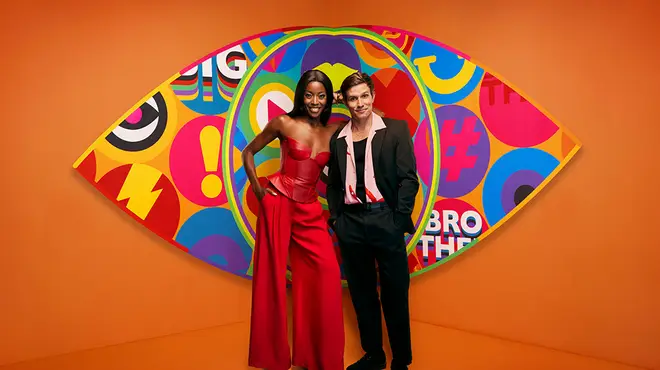 Celebrity Big Brother hosts AJ and Will in front of the Big Brother eye