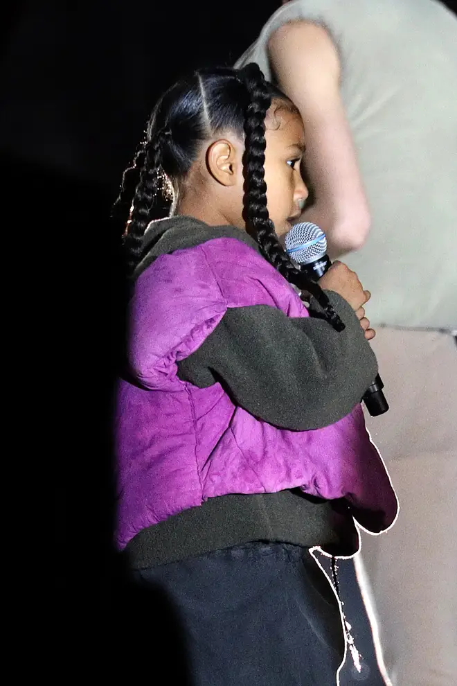North West is seen performing at the "Yeezy season 8" show