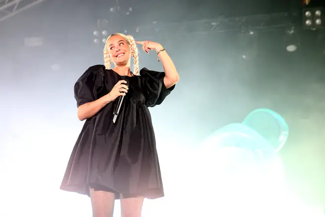 Anne-Marie wearing a smock dress while performing at the 2022 Splendour Festival
