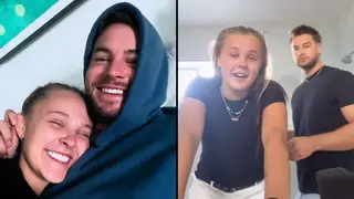 JoJo and Chris cuddling and standing together.