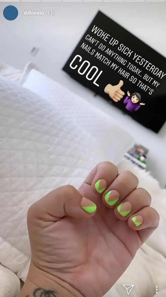 Demi Lovato shows off green nails