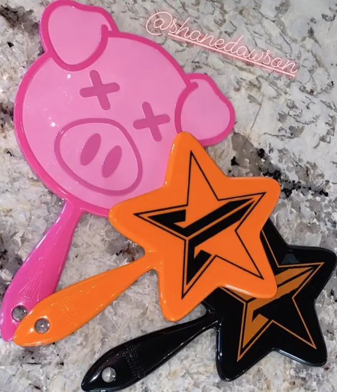 Shane Dawson has a pig-themed handheld mirror in the style of Jeffree Star's star
